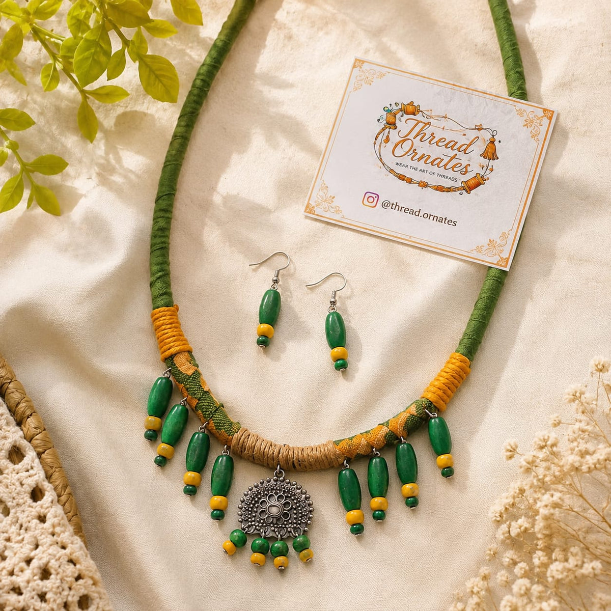 OLIVE GREEN DRAPED CHARMS NECKLACE